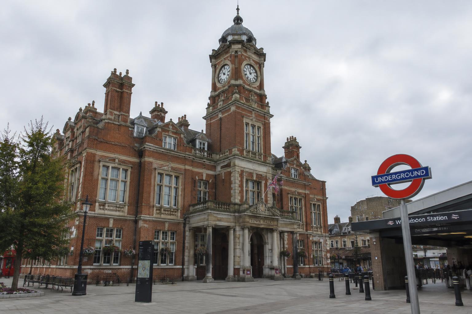 A red-brick Victorian town hall beside an Underground station
